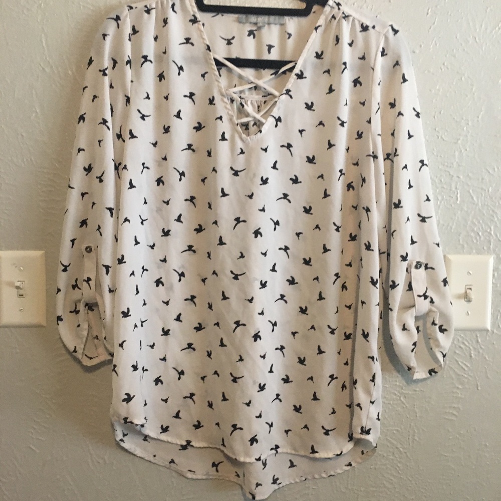White blouse with bird